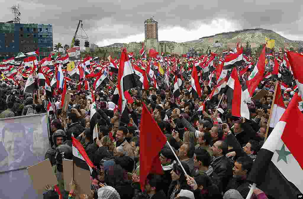 Supporters of Syrian President Bashar al-Assad rally in Damascus. (Reuters)