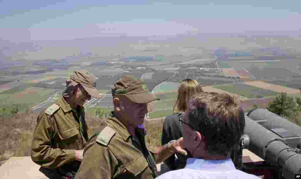 U.S. Defense Secretary Ash Carter (lower right) talks with Israel Defense Forces (IDF) 91st Division Commander Moni Katz (center) as Deputy Chief of Staff Maj. Gen. Yair Golan stands left, while they view the Hula Valley from the Hussein Lookout near Kiryat Shmona, in northern Israel along the border with Lebanon, July 20, 2015.