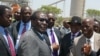 FILE - Zimbabwe's President Robert Mugabe (C-L) greets local chiefs at Zimplats mine, outside Harare.