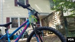 A bike awaits a 17-year-old refugee at the Ralbovsky home in Greenbelt, Maryland. The couple plan to take their foster son to the nearby farmers’ market and summer music festivals if the U.S State Department approves his travel to the U.S. (VOA/A. Arabasa