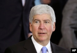 FILE - Michigan Gov. Rick Snyder speaks in Detroit. Snyder is under fire, accused of reacting too slowly to the water crisis in Flint.