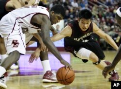 Jeremy Lin, right, playing college basketball for Harvard in an NCAA basketball game in Boston, Dec. 9, 2009.