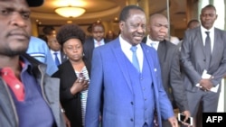 Raila Odinga, center, Kenya's opposition coalition leader, walks out after a press conference in Nairobi at which the coalition has presented proof of alleged fraud in Kenya's August 2017 presidential election in which sitting President Uhuru Kenyatta was declared winner, Jan. 26, 2018. 