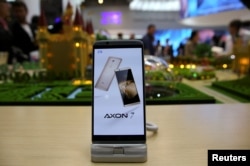 A ZTE Axon7 device is displayed at company's booth during Mobile World Congress in Barcelona, Spain, Feb. 27, 2017.