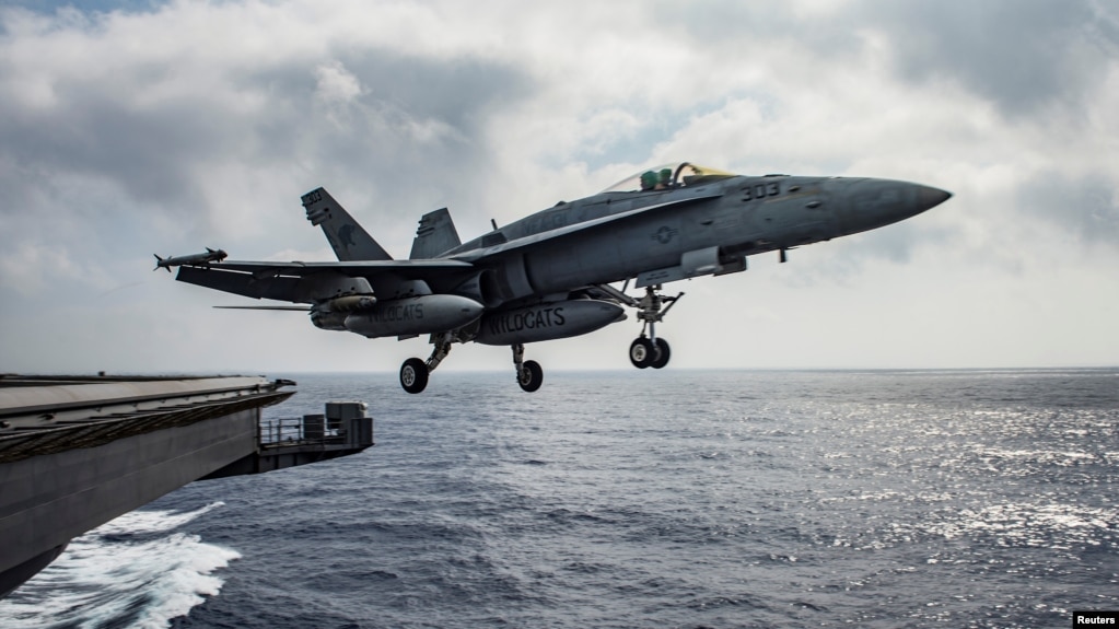 FILE - A U.S. Navy F/A-18E Super Hornet launches from the flight deck of the aircraft carrier USS Dwight D. Eisenhower in the Mediterranean Sea, June 28, 2016.