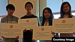 Young people from Lowell Community Health Center's Teen BLOCK held banners raising awareness of prescription drugs, during Opiate Awareness Week, at Lowell Community Health Center, on October 21, 2013.