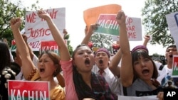 Burma people living in Malaysia chant slogans during a protest to condemn the persecutions committed by the Burmese army towards ethnic minorities, near the Burmese Embassy in Kuala Lumpur, Malaysia, October 11, 2011.
