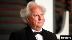 FILE- Editor and Chief of Vanity Fair Graydon Carter arrives at the 2015 Vanity Fair Oscar Party in Beverly Hills, California, Feb. 22, 2015. 