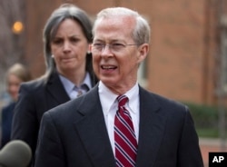 FILE - Dana Boente, then-first assistant U.S. attorney for the Eastern District of Virginia, leaves federal court in Alexandria, Va., Jan. 26, 2012. Boente was appointed to serve as acting attorney general after his predecessor refused to defend President Donald Trump's travel ban.