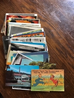 This stack of postcards Greg has sent to Eve. She calls it another "workaround" for not being able to see each other as often during the COVID pandemic. (Image courtesy of Eve)