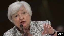 US Federal Reserve Chair Janet Yellen testifies before the Senate Committee on Banking , Housing, and Urban Affairs on Capitol Hill in Washington, DC, July 15, 2014. 