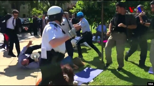 Washington D.C. police try to break up a clash between protesters and supporters of Turkish President Recep Tayyip Erdogan near the Turkish ambassador's residence, May 16, 2017.