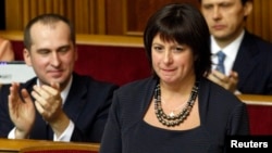 U.S. national Natalie Jaresko, who will serve as finance minister in Ukraine's new government, stands before MPs during a session of parliament in Kyiv Dec. 2, 2014.