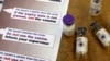 FILE - Vaccine bottles with newly developed expiry indicators are seen at a lab at PATH, the Program for Appropriate Technology in Health in Seattle, Oct. 3, 2008. 