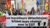Des membres de la CGT tiennent une banderole portant l'inscription "Des travailleurs détachés brisent leurs chaînes" afin de soutenir cinq travailleurs détachés marocains à Arles, France, le 4 octobre 2018.