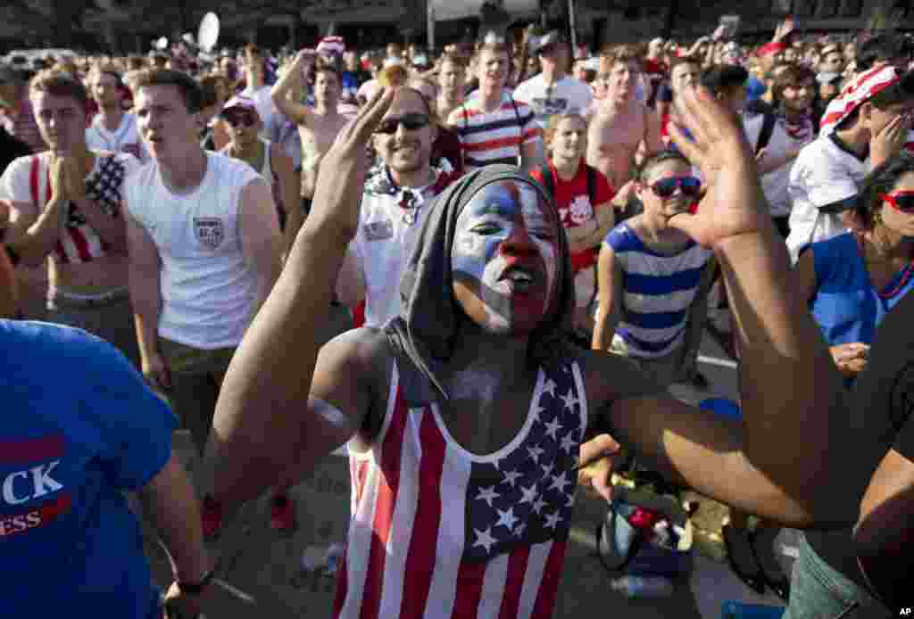 Collins Fon reacts as he watches the USA vs Belgium World Cup soccer match in Washington, July 1, 2014.