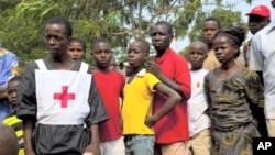 Ivorian refugees at makeshift camp in Bossou village, Guinea