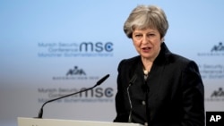 Britain's Prime Minister Theresa May speaks at the Security Conference in Munich, Germany, Feb. 17, 2018.