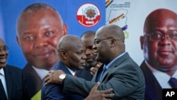 FILE - Felix Tshisekedi (R) of Congo's Union for Democracy and Social Progress opposition party, hugs Vital Kamerhe (L) of Congo's Union for the Congolese Nation opposition party, after being endorsed Kamerhe at a press conference in Nairobi, Kenya, Nov. 23, 2018. 