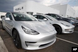 Tesla Model 3 is one of many electric vehicles powered by lithium-ion batteries. (AP Photo/David Zalubowski, File)