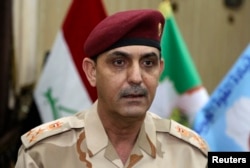 Brig. Yahya Rasooli, an Iraqi joint command spokesman, speaks during an interview with The Associated Press in Baghdad, March 28, 2017.