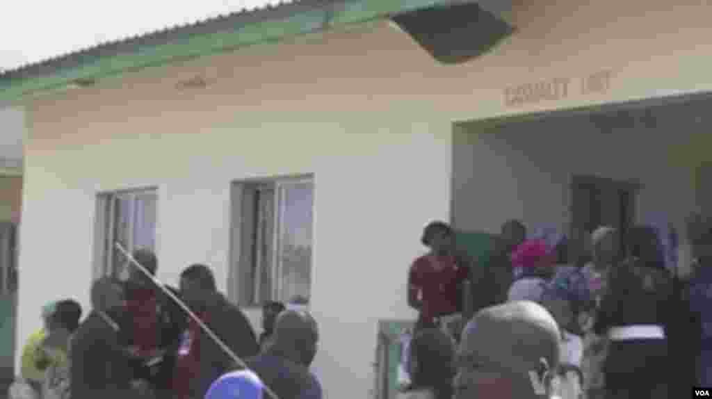 People gather around a hospital, Maiduguri, December 2013.