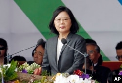 FILE - Taiwan's President Tsai Ing-wen delivers a speech during the National Day celebrations in front of the Presidential Building in Taipei, Taiwan, Tuesday, Oct. 10, 2017.