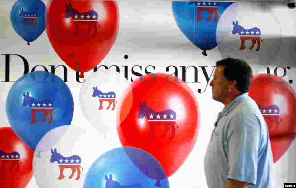 Advertisements for the DNC line the walls at the Charlotte Douglas International Airport.