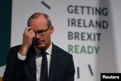 FILE PHOTO: Ireland's Minister for Foreign Affairs and Trade, Simon Coveney, speaks at a 'Getting Ireland Brexit Ready' workshop at the Convention Center in Dublin, Oct. 25, 2018.