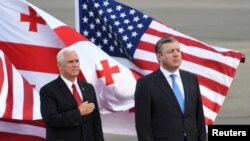 U.S. Vice President Mike Pence and Georgian Prime Minister Georgy Kvirikashvili attend a welcoming ceremony at the Tbilisi International Airport, Georgia, July 31, 2017.