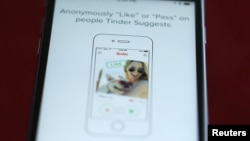 FILE - The dating app Tinder is shown on an Apple iPhone in this photo illustration.