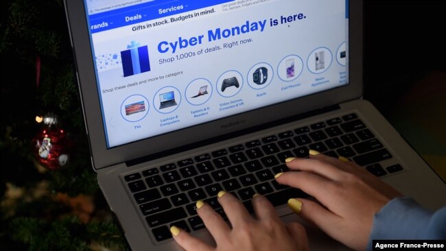 FILE - In this photo illustration, an ad for a Cyber Monday sale is displayed on a laptop on Nov. 30, 2020 in Arlington, Va.