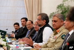 Pakistani Prime Minister Shahid Khaqan Abbasi, third right, speaks during his meeting with U.S.Secretary of State Rex Tillerson (not pictured) at the Prime Minister's residence, Oct. 24, 2017, in Islamabad, Pakistan.