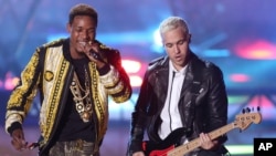 Fetty Wap, left, and Pete Wentz perform at the MTV Movie Awards at the Nokia Theater, on April 12, 2015, in Los Angeles.