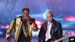 Fetty Wap, left, and Pete Wentz perform at the MTV Movie Awards at the Nokia Theater, on April 12, 2015, in Los Angeles.