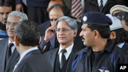 Aitzaz Ahsan, (C) the lawyer of Pakistan's prime minister Yusuf Raza Gilani, leaves after appearing the Supreme Court in Islamabad, February 2, 2012