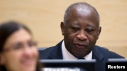 Laurent Gbagbo waits for the judges to arrive for his initial court appearance at the International Criminal Court in The Hague, December 5, 2011.