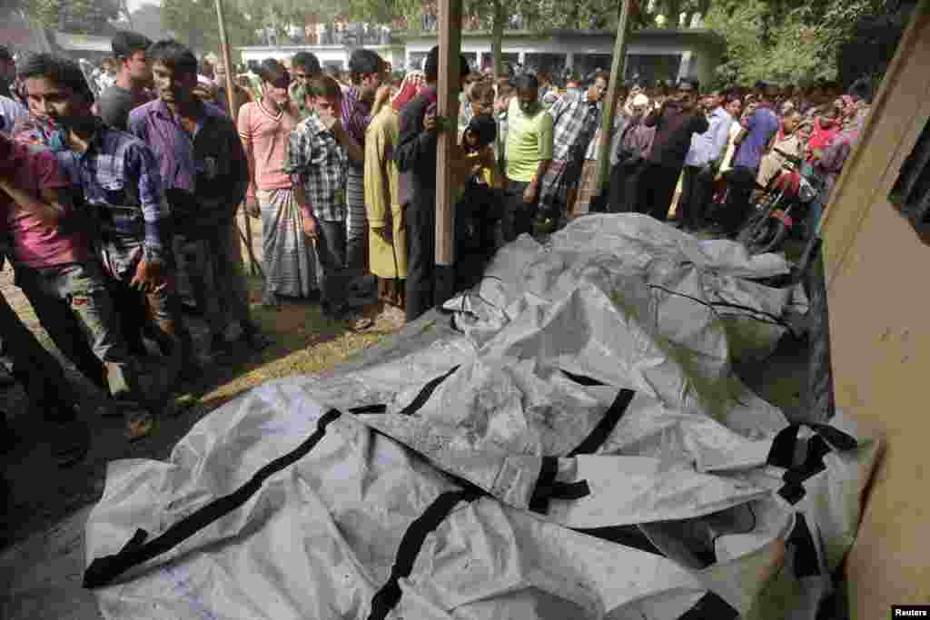 Bodies of dead garment workers are seen on the floor of a local school after a fire at a garment factory on the outskirts of Dhaka, Bangladesh, November 25, 2012.