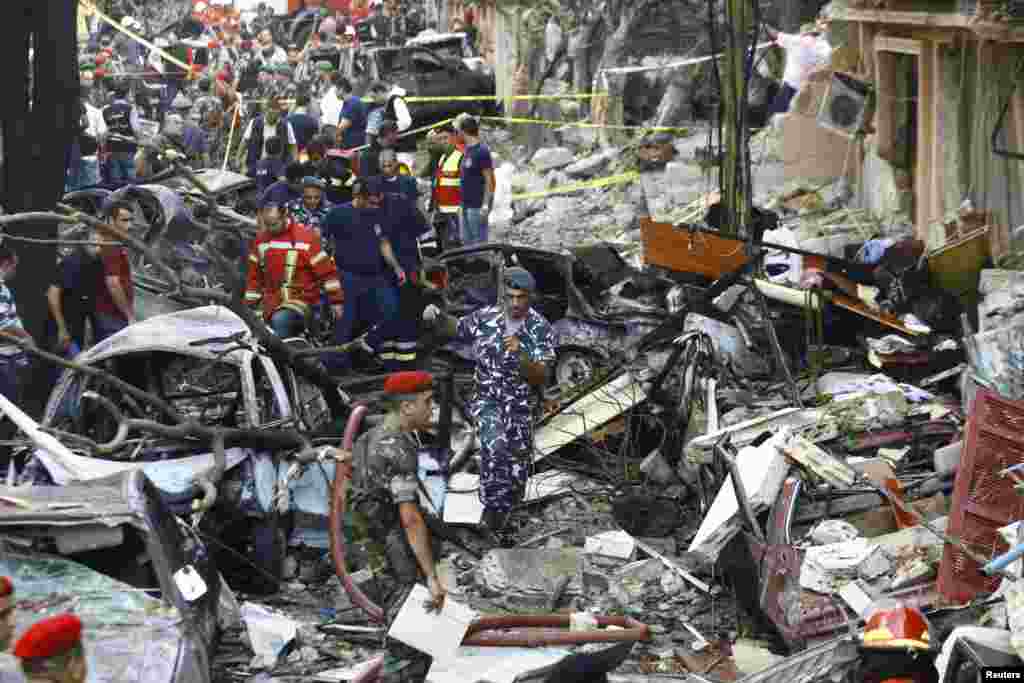 Lebanese soldiers and security personnel walk in rubble after an explosion in central Beirut, October 19, 2012.