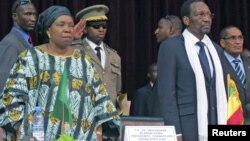 African Union Chief Nkosazana Dlamini-Zuma (front L) and Mali's President Dioncounda Traore attend a high level international meeting in Bamako, October 19, 2012. Regional leaders joined international organisations in Bamako on Friday trying to narrow their differences over whether al Qaeda-linked Islamists in the north of Mali should be dislodged via military intervention or a more gradual political approach. REUTERS/Adama Diarra 