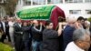 Relatives and friends carry the coffin of Salima Ayaz Merali, during her funeral, in Nairobi, Kenya, Sept. 25, 2013. Merali was killed alongside her daughter in last Saturday's Westgate Mall attack. 