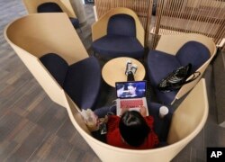 A student works on her computer in a study pod at the renovated James Branch Cabell Library on the campus of Virginia Commonwealth University in Richmond, April 18, 2016.