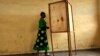 FILE - A voter walks toward a voting booth in Bujumbura, Burundi, as people prepared to vote in a presidential election.