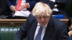 In this grab taken from video, Britain's Prime Minister Boris Johnson speaks during Prime Minister's Questions in the House of Commons, London, Dec. 8, 2021.