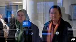 Members of a delegation of the Mothers of Srebrenica and several other Bosnian organizations tour the DNA lab of the International Commission on Missing Persons, ICMP, in The Hague, Netherlands, Nov. 20, 2017, two days ahead of planned verdicts in the trial against Bosnian Serb military commander Gen. Ratko Mladic at the Yugoslav War Crimes Tribunal.