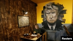 A visitor has a meal at Trump Burger, a new Russian diner named after U.S. President Donald Trump, in Krasnoyarsk, Russia July 17, 2018. (REUTERS/Ilya Naymushin)