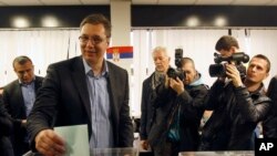 Serbian Progressive Party leader Aleksandar Vucic casts his ballot at a polling station in Belgrade, Serbia, March 16, 2014.