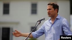 FILE - Congressman Seth Moulton (D-MA) speaks at a Merrimack County Democrats Summer Social at the Swett home in Bow, New Hampshire, July 28, 2018. 