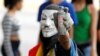 An opposition demonstrator shows a tear gas grenade while clashing with riot police during the so called "mother of all marches" against Venezuela's President Nicolas Maduro in Caracas, Venezuela, April 19, 2017.