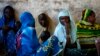 Internally displaced women from Bangui attend a community meeting in Bambari, Central Africa Republic, June 16, 2014.